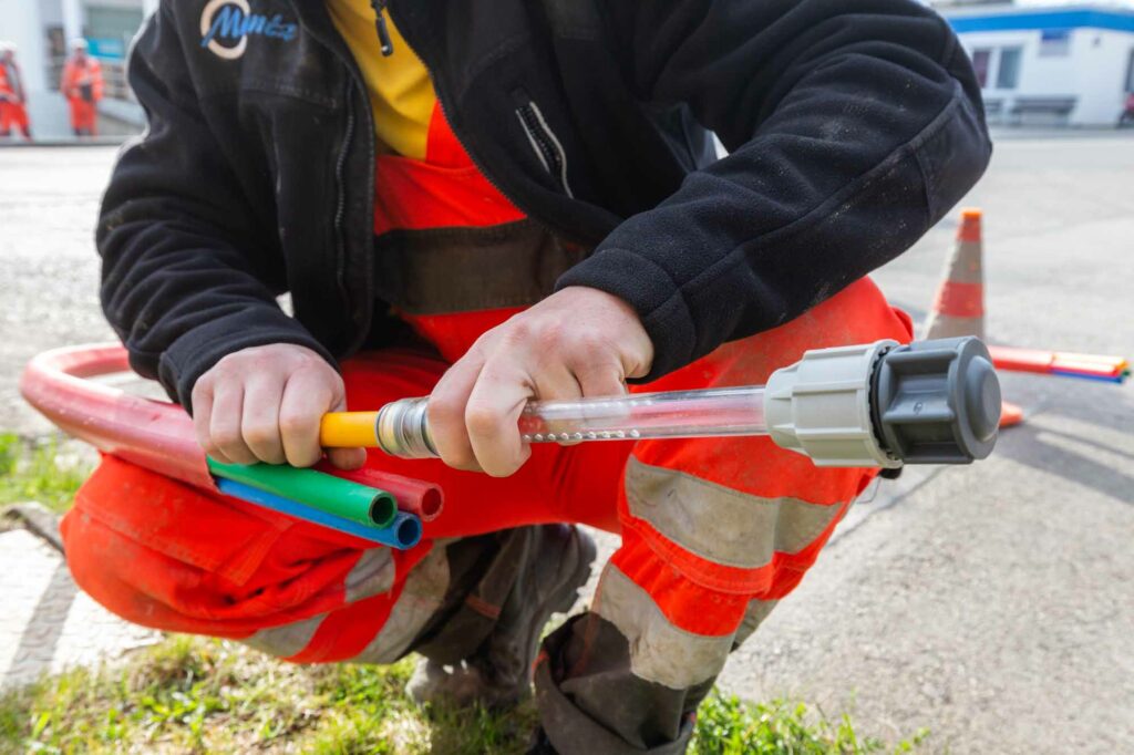 Bunte Rohre, Arbeiter, Straßenbau, Anschluss.